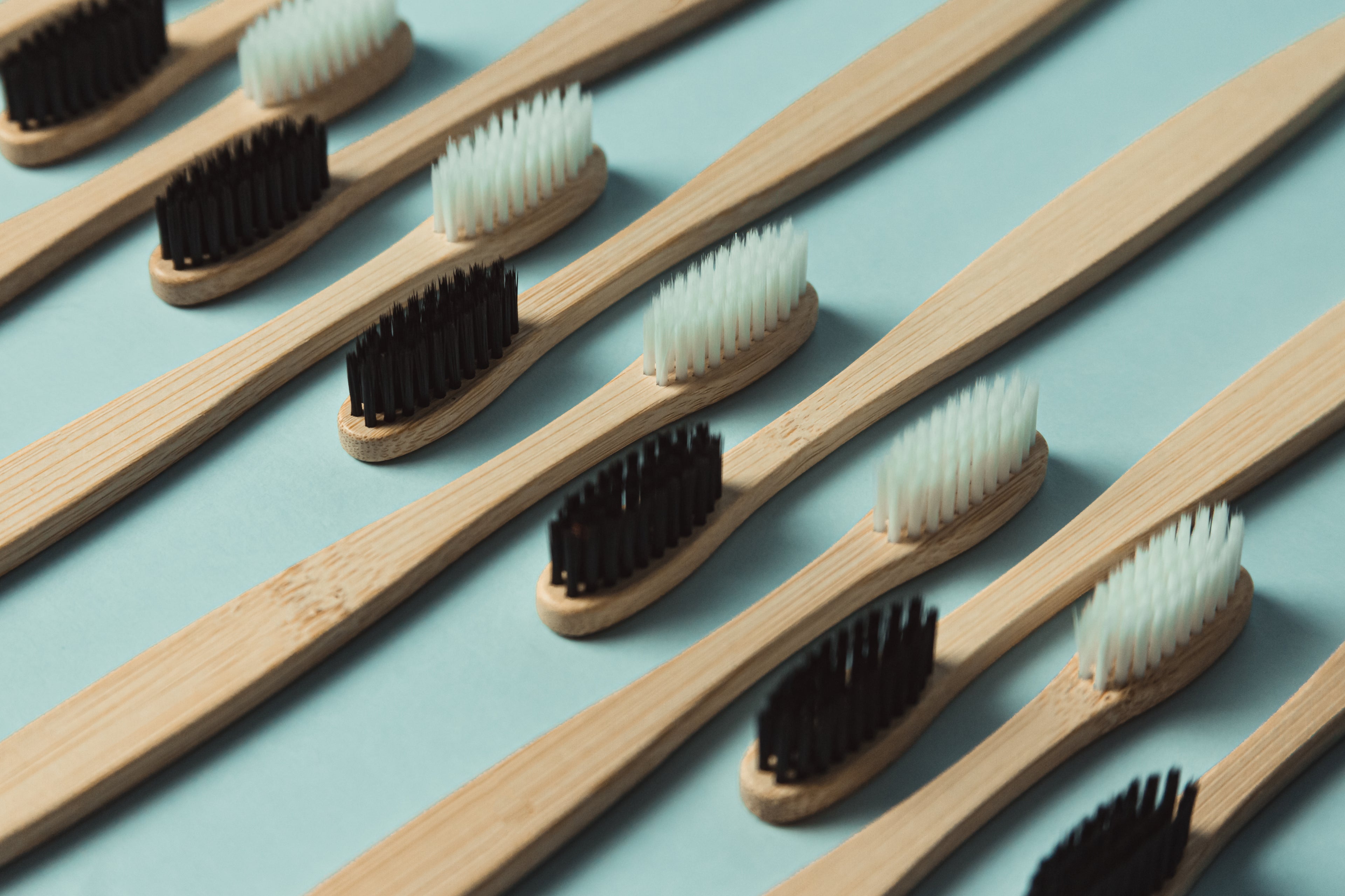 View of toothbrushes in different colors. Y-Brush